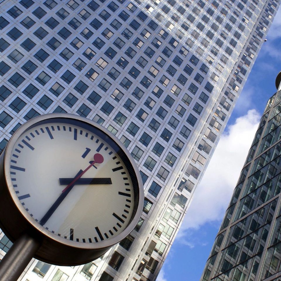 Street View Looking Upwards of High City Buildings and Clock